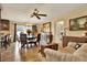 Spacious dining area with a large table and access to the kitchen at 8809 Shoemaker Ln, Hudson, FL 34667