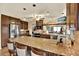 Large kitchen with granite island, stainless steel appliances, and lots of counter space at 8809 Shoemaker Ln, Hudson, FL 34667