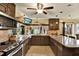 Spacious kitchen featuring granite countertops and stainless steel appliances at 8809 Shoemaker Ln, Hudson, FL 34667