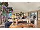 Bright living room with hardwood floors and a cozy seating arrangement at 8809 Shoemaker Ln, Hudson, FL 34667