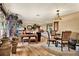 Spacious living area with hardwood floors, comfortable seating, and a dining area at 8809 Shoemaker Ln, Hudson, FL 34667