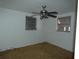 Simple bedroom with carpet and ceiling fan at 9241 Cochise Ln, Port Richey, FL 34668