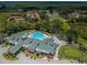 Aerial view of community clubhouse, pool, and golf course at 9338 Clearmeadow Ln, New Port Richey, FL 34655
