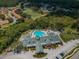 Aerial view of community clubhouse and pool at 9338 Clearmeadow Ln, New Port Richey, FL 34655