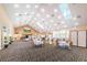 Large banquet hall with tables and chairs at 9338 Clearmeadow Ln, New Port Richey, FL 34655