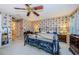 Primary bedroom with floral wallpaper and ensuite bathroom at 9338 Clearmeadow Ln, New Port Richey, FL 34655