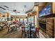 Spacious clubhouse interior with a fireplace and dining area at 9338 Clearmeadow Ln, New Port Richey, FL 34655