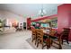 Spacious dining area with a large wooden table and chairs, offering an open floor plan at 9338 Clearmeadow Ln, New Port Richey, FL 34655