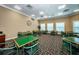 Game room with green tables and chairs at 9338 Clearmeadow Ln, New Port Richey, FL 34655