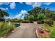 Landscaped path for golf carts near the course at 9338 Clearmeadow Ln, New Port Richey, FL 34655