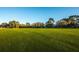 Expansive green golf course with homes in the background at 9338 Clearmeadow Ln, New Port Richey, FL 34655
