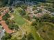 Aerial view of community golf course and homes at 9338 Clearmeadow Ln, New Port Richey, FL 34655