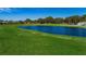 Picturesque golf course with pond and green at 9338 Clearmeadow Ln, New Port Richey, FL 34655