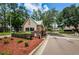Gated community entrance with guard house and landscaping at 9338 Clearmeadow Ln, New Port Richey, FL 34655