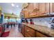 Well-equipped kitchen with granite countertops, stainless steel appliances, and custom cabinetry at 9338 Clearmeadow Ln, New Port Richey, FL 34655