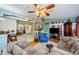 Living room showcasing an open floor plan and hardwood floors at 9338 Clearmeadow Ln, New Port Richey, FL 34655