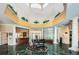 Grand lobby with marble floors and piano at 9338 Clearmeadow Ln, New Port Richey, FL 34655