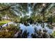 Serene pond with lush foliage and tranquil reflections at 9338 Clearmeadow Ln, New Port Richey, FL 34655