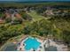 Aerial view of community pool and surrounding area at 9338 Clearmeadow Ln, New Port Richey, FL 34655