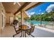 Relaxing pool deck with tables, chairs, and stunning pool views at 9338 Clearmeadow Ln, New Port Richey, FL 34655