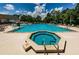 Refreshing pool and spa with plenty of lounge chairs at 9338 Clearmeadow Ln, New Port Richey, FL 34655