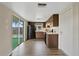 Kitchen features wood cabinets and black appliances at 9744 Rainelle Ln, Port Richey, FL 34668