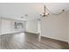 Living room features laminate floors and large window at 9744 Rainelle Ln, Port Richey, FL 34668