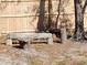 Rustic log bench in backyard next to wooden fence at 11743 Purdue St, New Port Richey, FL 34654