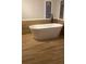Bathroom featuring a freestanding bathtub at 11743 Purdue St, New Port Richey, FL 34654