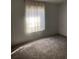 Bedroom with sheer curtains and carpet at 11743 Purdue St, New Port Richey, FL 34654