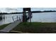 Lake boat ramp with informational signs and caution at 11743 Purdue St, New Port Richey, FL 34654