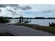 Lake access with a dock and signage at 11743 Purdue St, New Port Richey, FL 34654