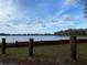 Peaceful lake view with a partly cloudy sky at 11743 Purdue St, New Port Richey, FL 34654