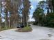 Residential road with trees and parked car at 11743 Purdue St, New Port Richey, FL 34654