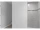 Grey tiled shower in a simple bathroom at 12040 Pine Warbler Ave, Brooksville, FL 34614