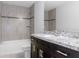 Bathroom with tub, vanity, and granite countertop at 12040 Pine Warbler Ave, Brooksville, FL 34614