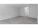 Spacious bedroom with neutral walls and plush carpeting at 12040 Pine Warbler Ave, Brooksville, FL 34614