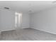 Bright and airy bedroom with grey carpeting and ample space at 12040 Pine Warbler Ave, Brooksville, FL 34614