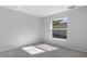 Bright bedroom with grey walls and carpeted floor at 12040 Pine Warbler Ave, Brooksville, FL 34614