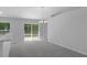 Open dining area with a view of the back yard, and access to the kitchen and other rooms at 12040 Pine Warbler Ave, Brooksville, FL 34614