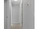 Bright hallway with neutral walls and tile flooring at 12040 Pine Warbler Ave, Brooksville, FL 34614