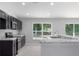Spacious kitchen with granite countertops and ample cabinet space at 12040 Pine Warbler Ave, Brooksville, FL 34614