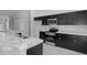 Modern kitchen with stainless steel appliances and granite countertops at 12040 Pine Warbler Ave, Brooksville, FL 34614