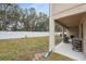Spacious backyard with a grassy area and white fence at 12307 Duckett Ct, Spring Hill, FL 34610