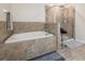Bathroom with a large soaking tub and a separate shower at 12307 Duckett Ct, Spring Hill, FL 34610
