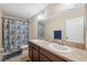 Bathroom with double vanity, shower/tub combo, and updated fixtures at 12307 Duckett Ct, Spring Hill, FL 34610