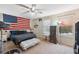 Bedroom with a queen-size bed, dresser, and large window at 12307 Duckett Ct, Spring Hill, FL 34610