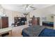 Spacious bedroom with carpeted floor, ceiling fan, and ample closet space at 12307 Duckett Ct, Spring Hill, FL 34610