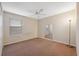 Bright bedroom featuring carpeted floors and a large window with blinds at 12307 Duckett Ct, Spring Hill, FL 34610
