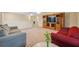 Spacious bonus room with two couches and built-in entertainment center at 12307 Duckett Ct, Spring Hill, FL 34610